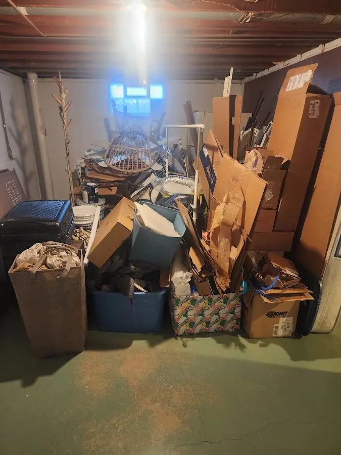 Roll-off dumpster container at job site for 2 Yard Dumpster Rental in Bethel